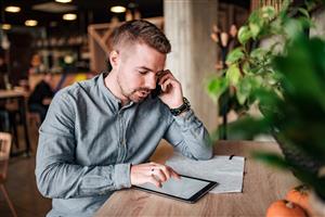 Man Working on Tablet
